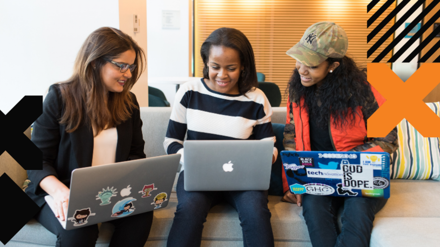 3 colleagues working on their laptops together