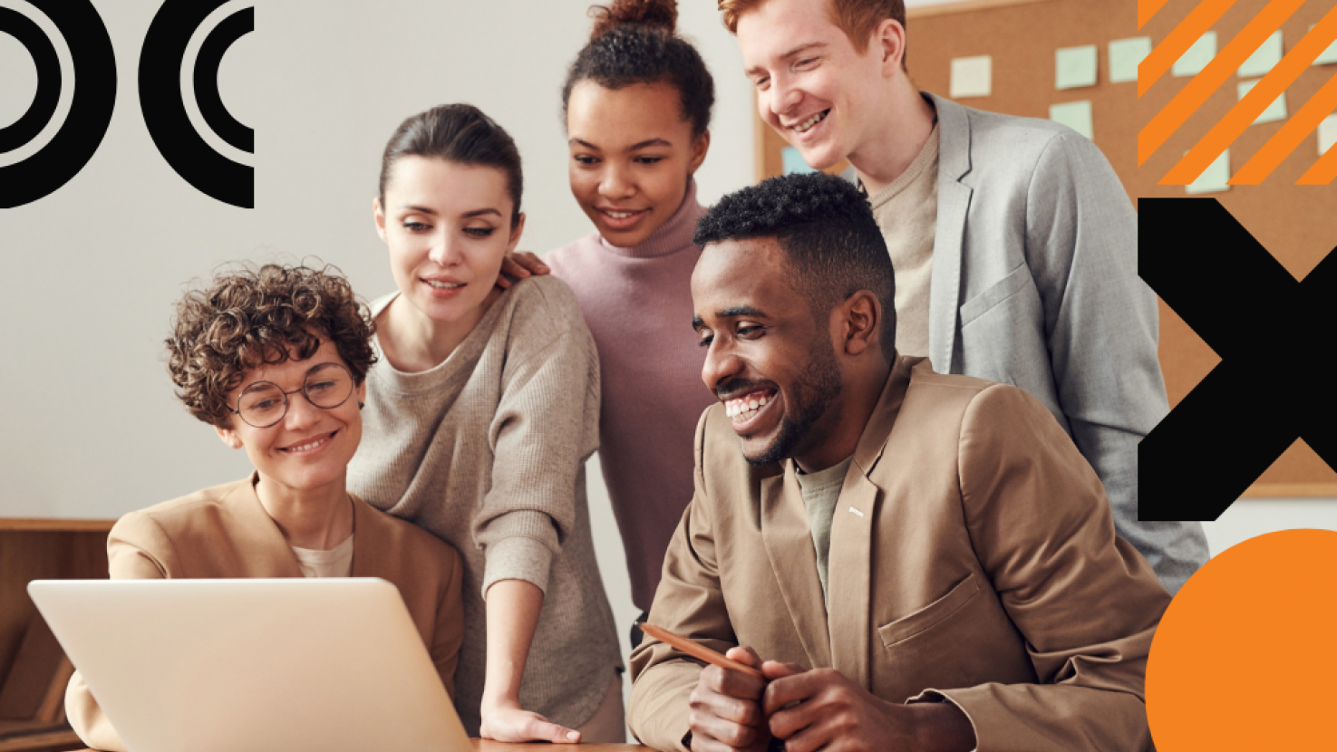 A group of teammates gathering around a laptop