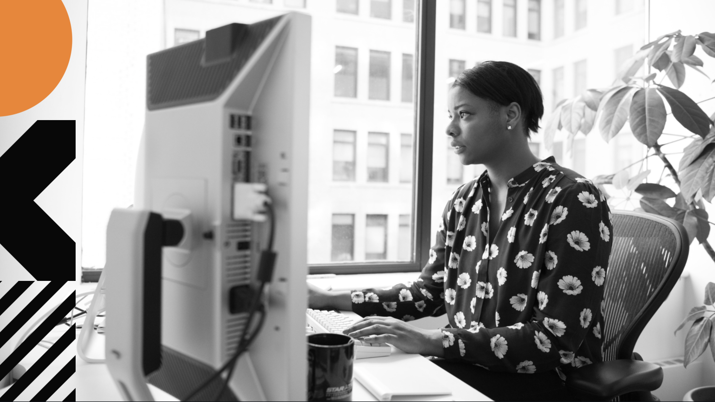 Concerned woman looking at her computer at her desk