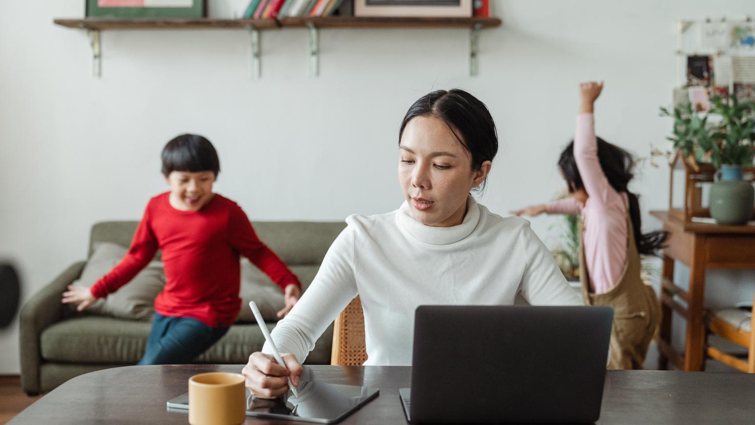 working from home with kids running around behind