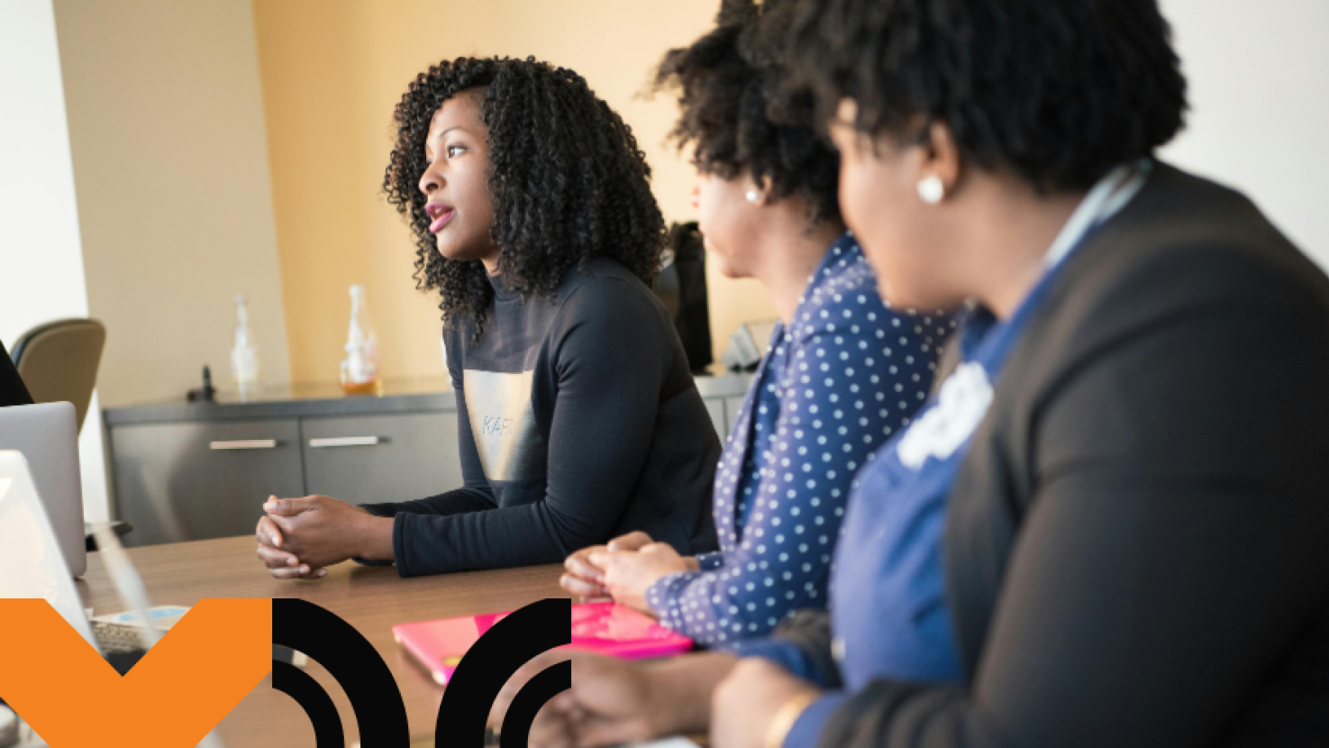 three women working together at a desk