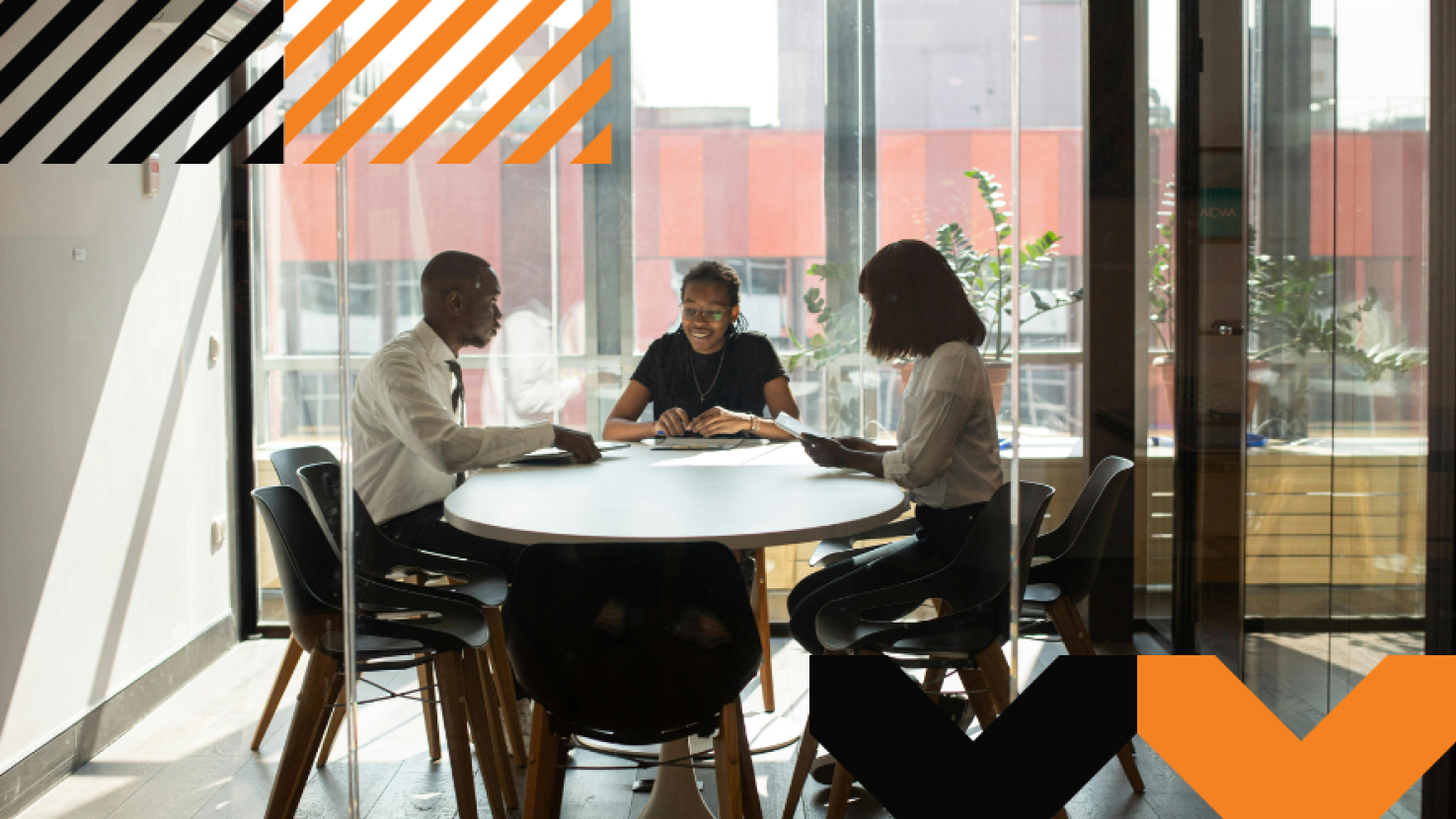 3 coworkers collaborating in an office room