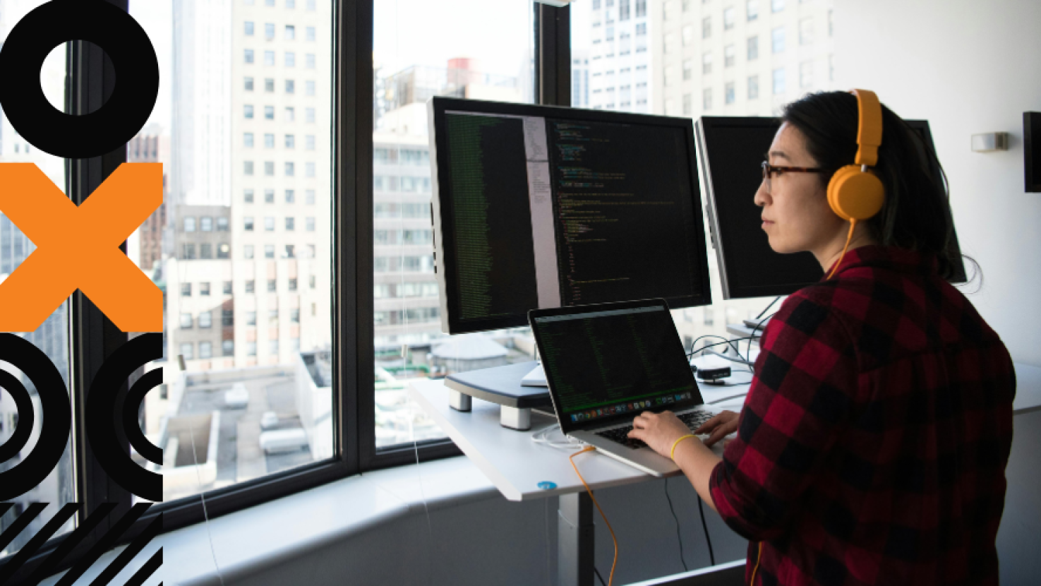 Person working at their desk and looking out the window